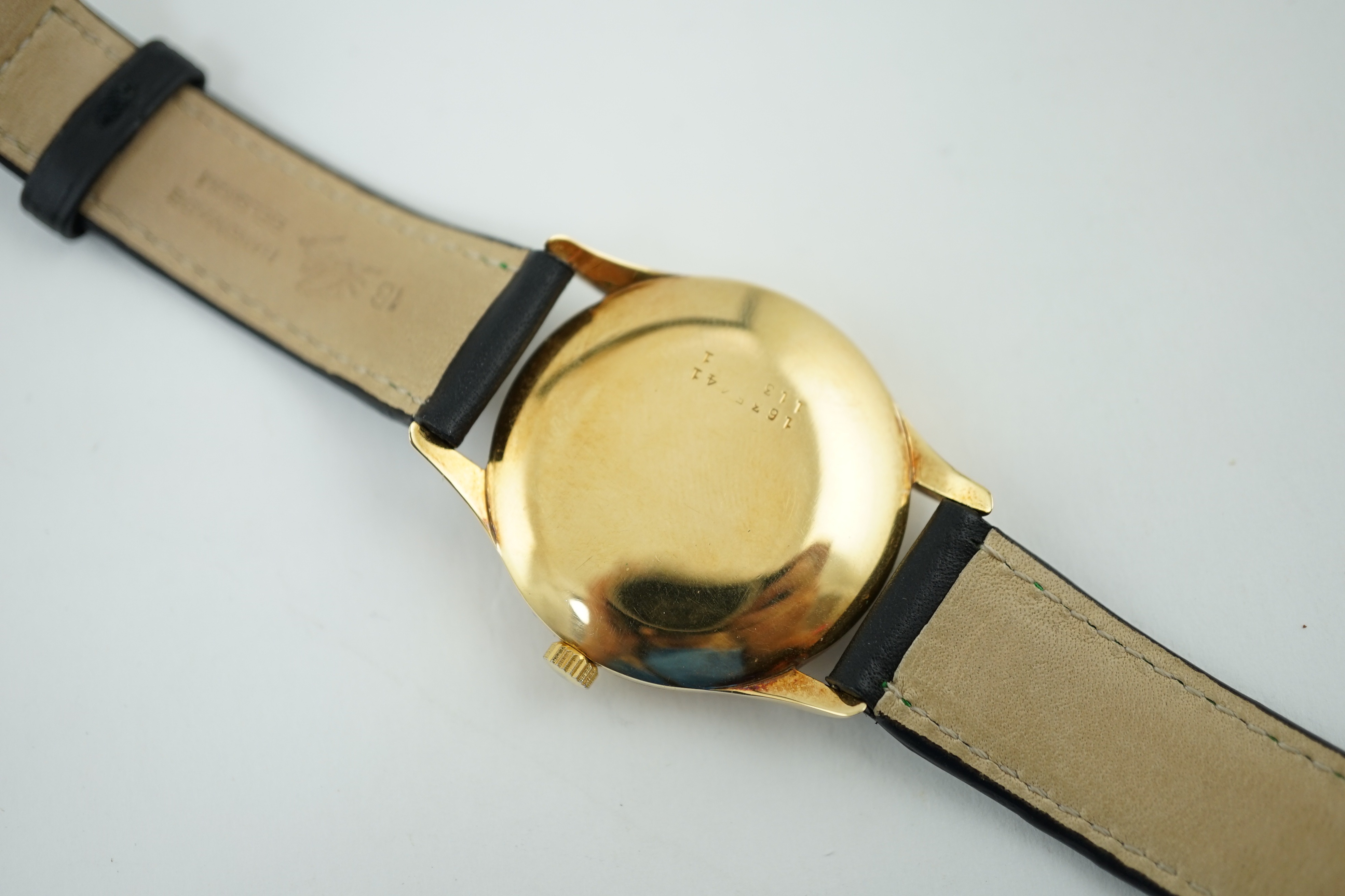 A gentleman's 1950's 18k gold Universal Monodate manual wind wrist watch